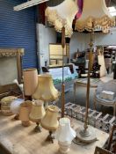 A pair of brass table lamps together with two onyx table lamps, a treen table lamp,