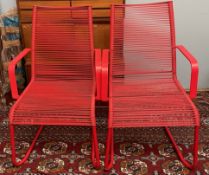 Two Ikea red metal elbow chairs