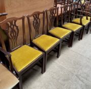 a set if five George III style mahogany dining chairs with pierced vase splats and drop on seats on