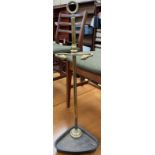A brass and cast iron stick stand,