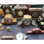 An oak cased Napoleon hat mantle clock together with a collection of mantle clocks and clock cases