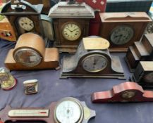 An oak cased Napoleon hat mantle clock together with a collection of mantle clocks and clock cases