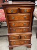 A reproduction walnut miniature chest on chest,