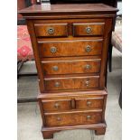 A reproduction walnut miniature chest on chest,