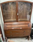 A 20th century oak bureau bookcase, with as glazed top,