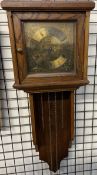 A modern oak framed wall clock,