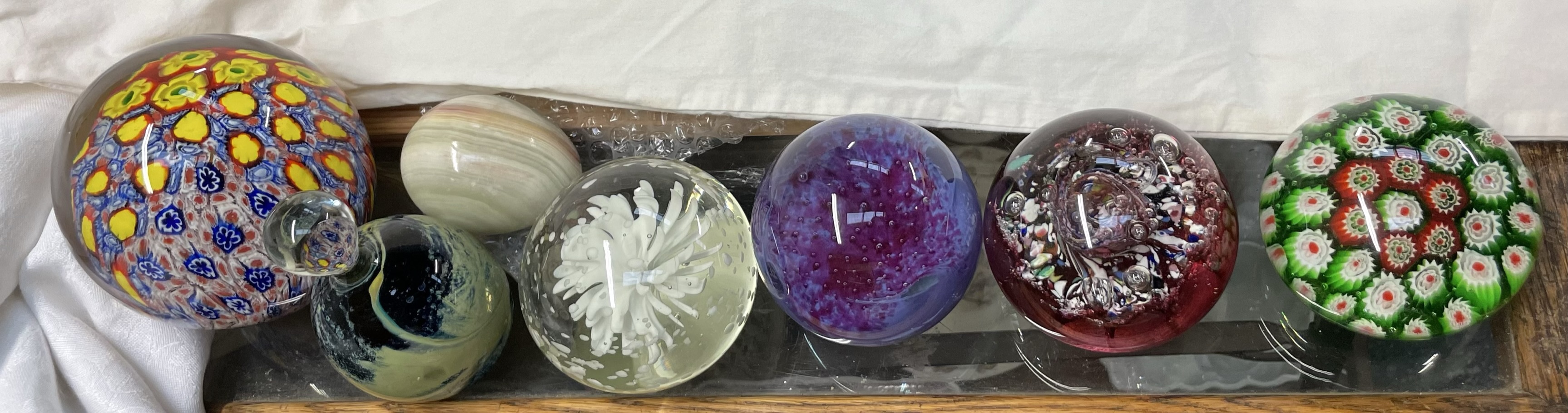 A Caithness Myriad paperweight together with other glass paperweights