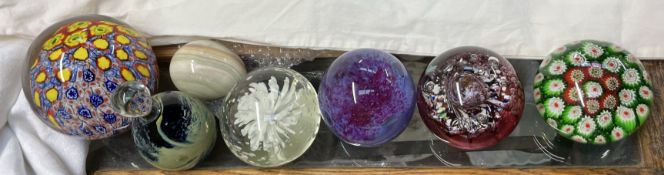 A Caithness Myriad paperweight together with other glass paperweights