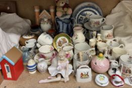 A Staffordshire cottage pastille burner together with jugs, commemorative mugs,