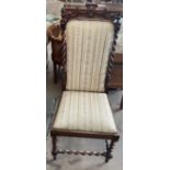 A Victorian walnut chair with a pierced top rail and barley twist columns with a pad upholstered