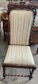 A Victorian walnut chair with a pierced top rail and barley twist columns with a pad upholstered