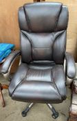 A brown leather faced office chair