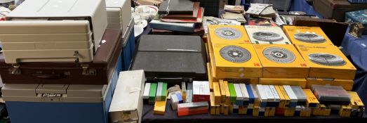 Kodak carousel slide tray magazines together with a collection of slides,