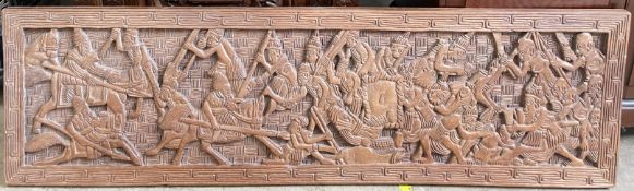 An Anglo Indian carved panel depicting fighting warriors