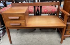 A Chippy heath teak telephone table,