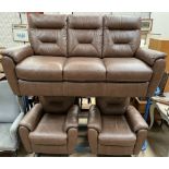 A brown leather three piece suite