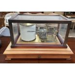 A Rototherm barograph in a glazed case with a base drawer