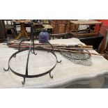 A wrought iron hanging hooks of circular form together with a lantern and fishing rod parts and