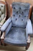 An early 19th century mahogany framed library chair with button back upholstery,