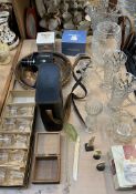 A Super 8 camera together with glass vases, carved bone figures, a wooden plate,