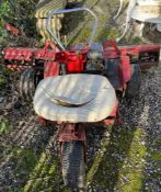 A ride on lawn mower with three wheels and Briggs and Stratton engine (Sold for spares)