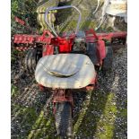 A ride on lawn mower with three wheels and Briggs and Stratton engine (Sold for spares)