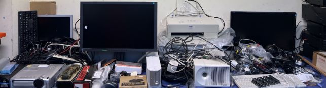 A large lot including a PLUS U7-132 projector, computer monitors, computer accessories, printers,