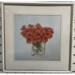 A print of a vase of poppies