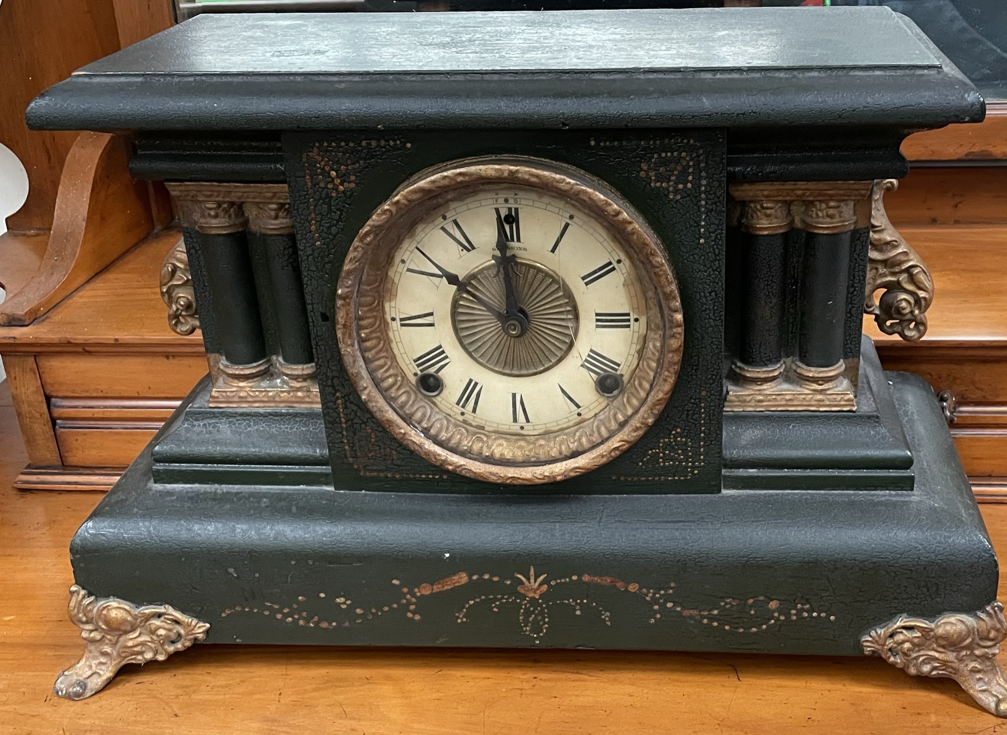 An ebonised mantle clock,