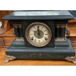 An ebonised mantle clock,