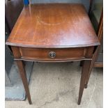 A reproduction mahogany Pembroke table with drop flaps and a frieze drawer on square tapering legs