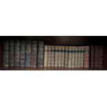 Various leather bound volumes including The Works of Lord Macaulay, Disraeli's Works,