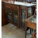 An Edwardian mahogany chiffonier base with a shaped top above a drawer and glazed doors and sides