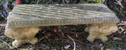 A reconstituted stone bench on square feet