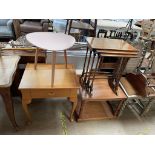 A nest of three yew tables together with a modern side table a coffee table and an elliptical table