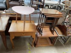 A nest of three yew tables together with a modern side table a coffee table and an elliptical table