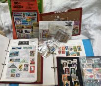 Two stamp albums and a stock book of world stamps together with other stamps