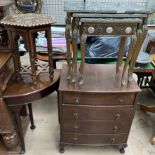 A reproduction mahogany chest with four drawers together with a nest of three faux marble tables,