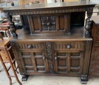 A 20th century oak court cupboard