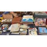 A large quantity of cigarette cards, loose and in albums together with model cars,