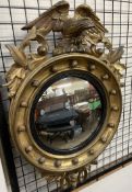 A 19th century convex wall mirror with eagle surmount and ball decoration, 52.