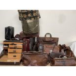 A leather covered travelling doctors bag together with a collection of leather bags, cases,