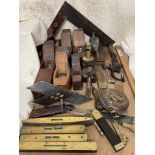 Assorted woodworking tools, including planes, set squares, spirit levels,