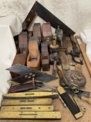 Assorted woodworking tools, including planes, set squares, spirit levels,