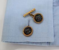 A pair of Boucheron of Paris yellow metal cufflinks of domed form with green and blue striped