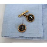 A pair of Boucheron of Paris yellow metal cufflinks of domed form with green and blue striped