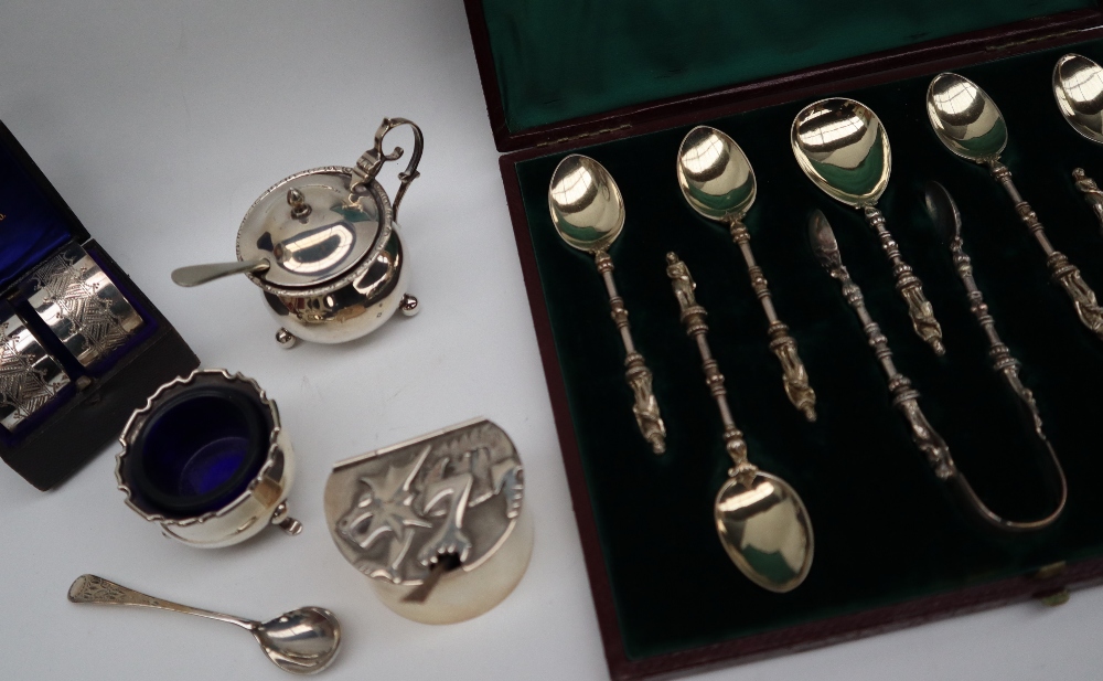 A set of six Victorian silver gilt apostle spoons and matching sugar nips and caddy spoon, London,