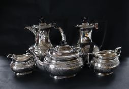 A George VI silver five piece tea and coffee service, with scrolling leaves engraved to the body,