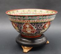 A Chinese porcelain bowl, the interior with a yellow and orange band above a green ground,