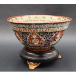 A Chinese porcelain bowl, the interior with a yellow and orange band above a green ground,